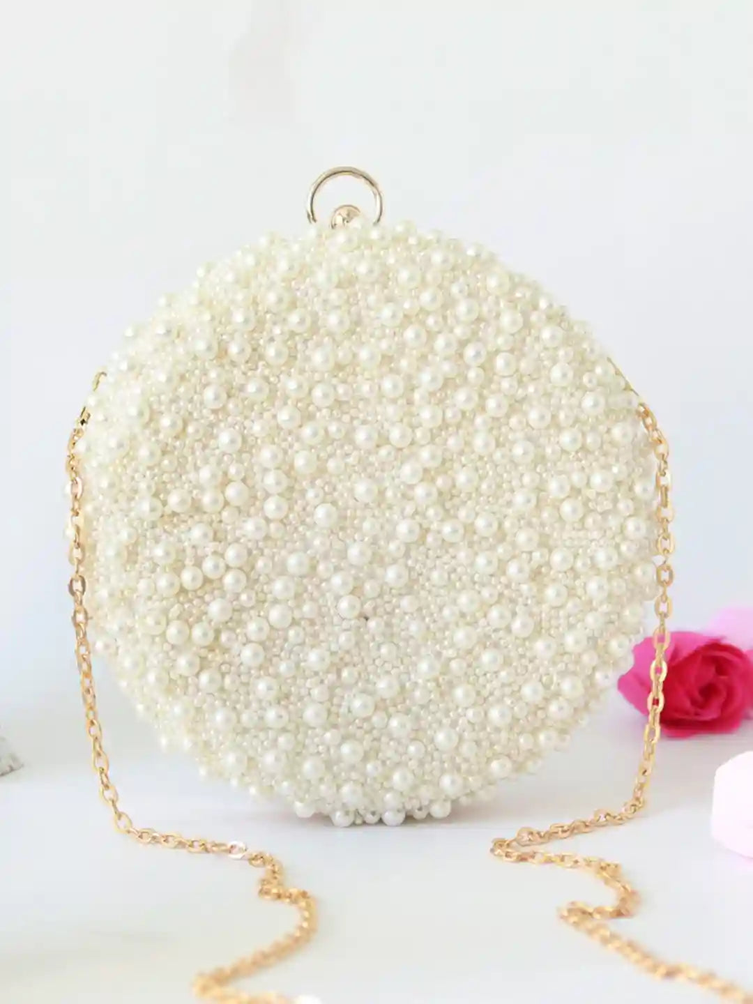 White pearl hand-embroidered clutch bag by Gauhar from The Tan Clan, featuring intricate embroidery and elegant design.