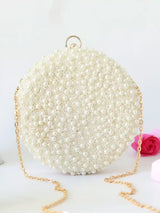 White pearl hand-embroidered clutch by Gauhar from The Tan Clan, featuring intricate embroidery and elegant design.