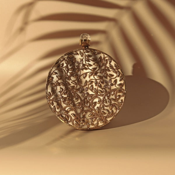 Intricate brass work with mother of pearl clutch purse by Gazal from The Tan Clan, featuring detailed craftsmanship and elegant design.