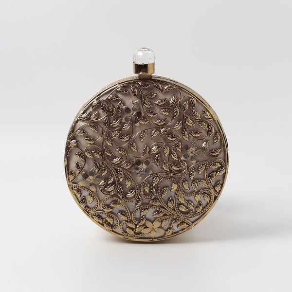 Intricate brass work with mother of pearl clutch by Gazal from The Tan Clan, showcasing detailed craftsmanship and elegant design.