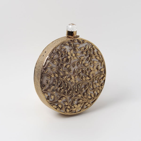 Intricate brass work with mother of pearl on The Tan Clan Gazal clutch, showcasing detailed craftsmanship and elegant design.