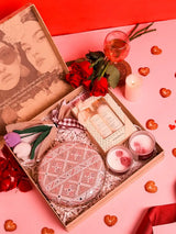 Premium gift set from THE TAN CLAN featuring four items and a stylish clutch in a sleek box.