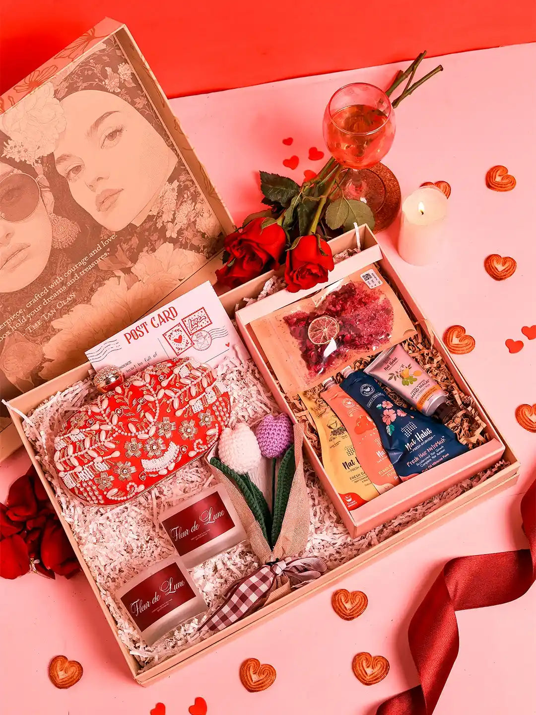 Premium gift set from THE TAN CLAN featuring 8 items and a stylish clutch in a sleek box, ideal for special occasions.