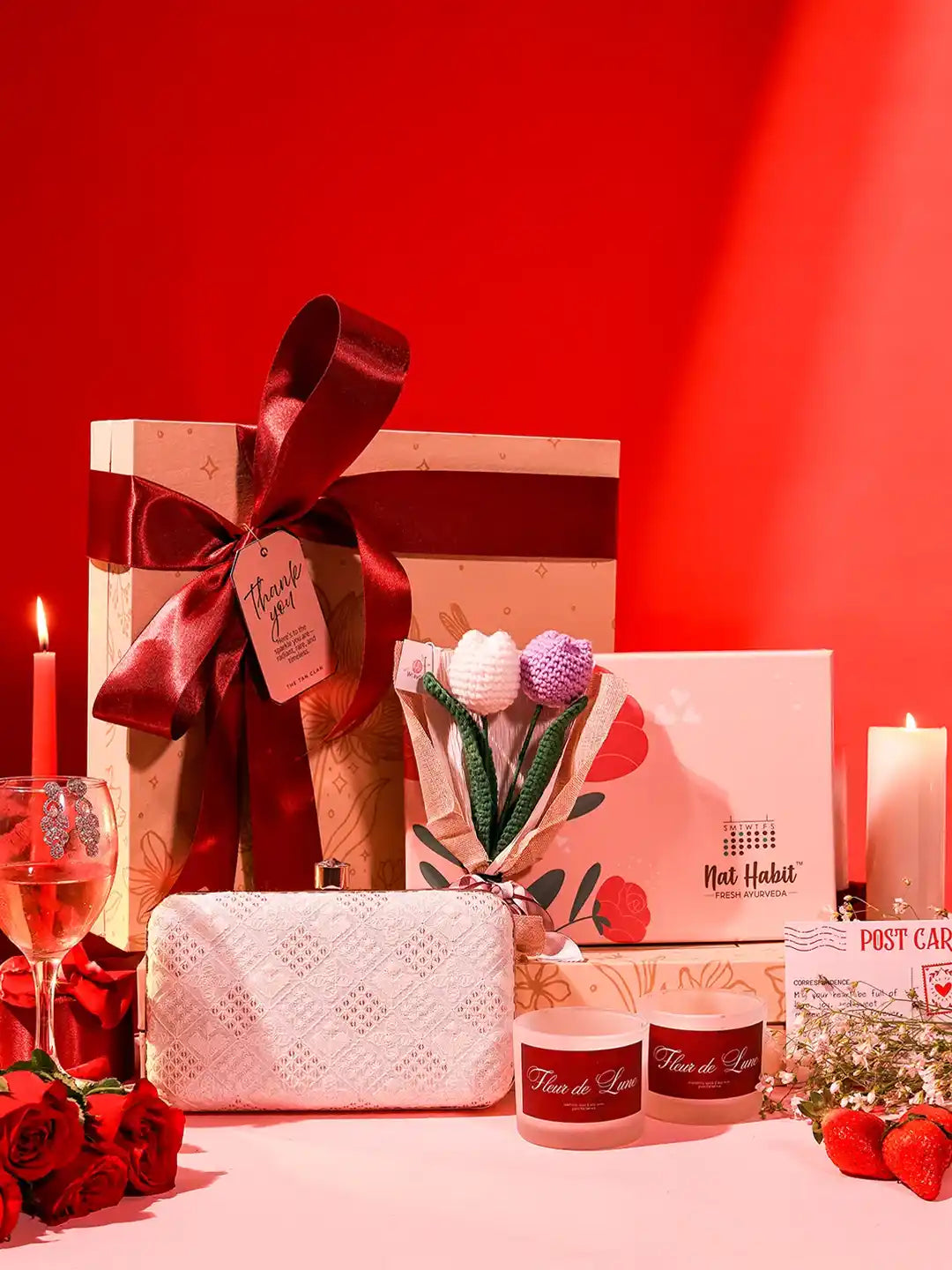 Premium gift set by THE TAN CLAN featuring 8 items including a stylish clutch in a sleek box.
