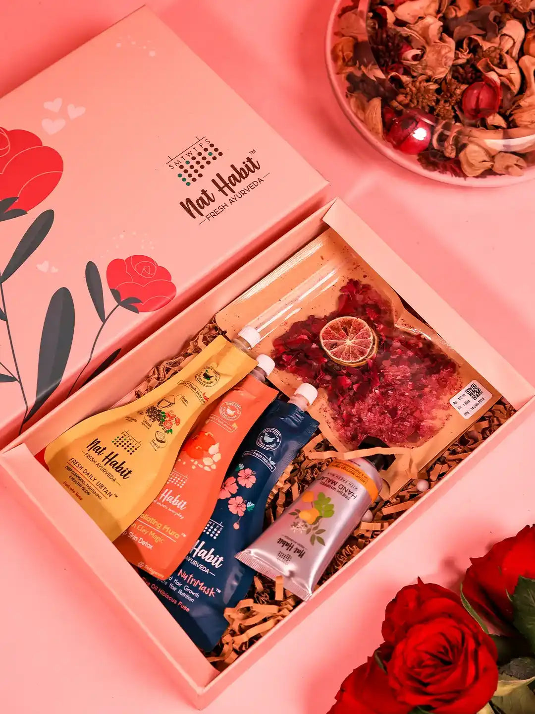Premium gift set from THE TAN CLAN featuring 8 stylish items and a clutch in an elegant box, perfect for gifting occasions.