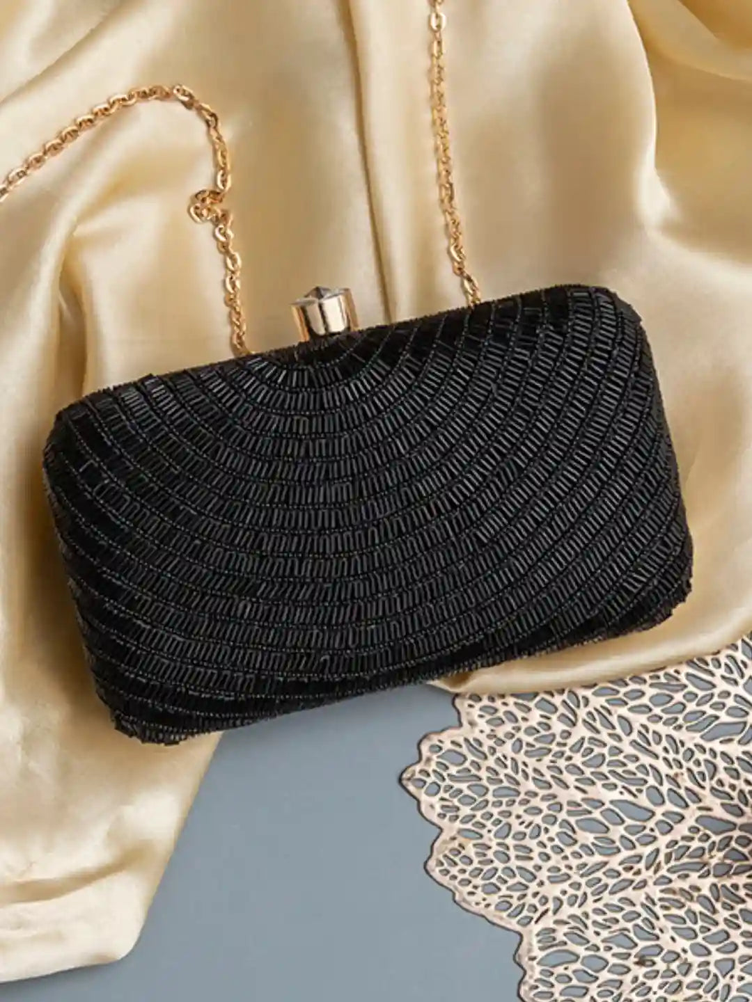 Black embroidered party clutch bag with glitz detailing from The Tan Clan, featuring hand-embroidery and a sleek, elegant design.