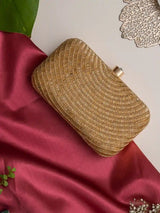 Golden hand-embroidered party clutch by The Tan Clan featuring glittering accents and elegant design for special occasions.