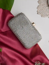 Silver hand-embroidered party clutch with beige flap, featuring intricate glittering details, by The Tan Clan.
