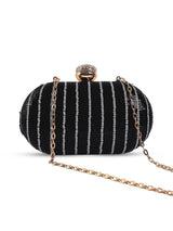 Glow black sequins oval clutch by The Tan Clan, featuring shimmering sequins and a sleek oval shape for elegant occasions.