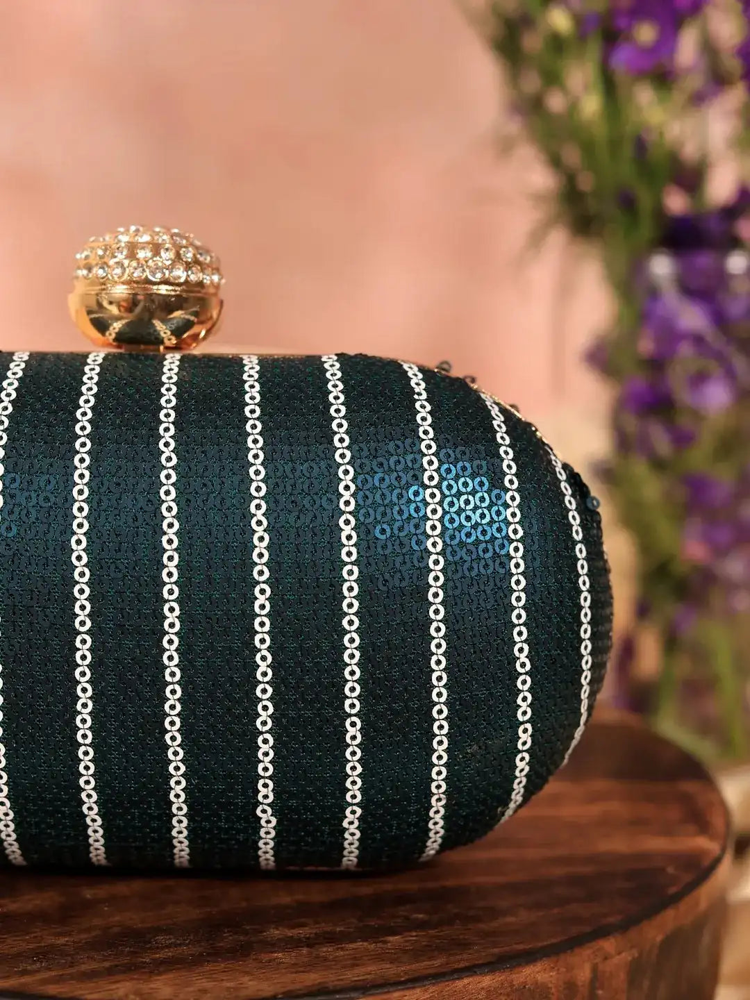 Glow Blue Sequins Oval Clutch by The Tan Clan featuring shimmering sequins and elegant oval shape for stylish occasions.