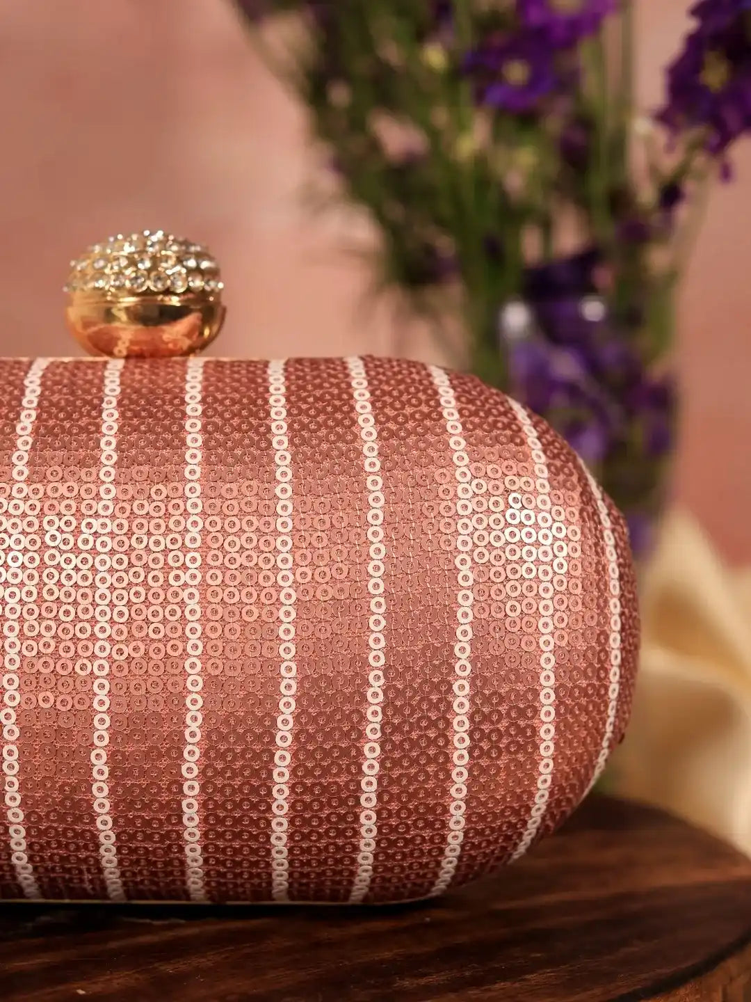 Glow pink sequins oval clutch bag by The Tan Clan with shimmering sequin details and a sleek, elegant design.
