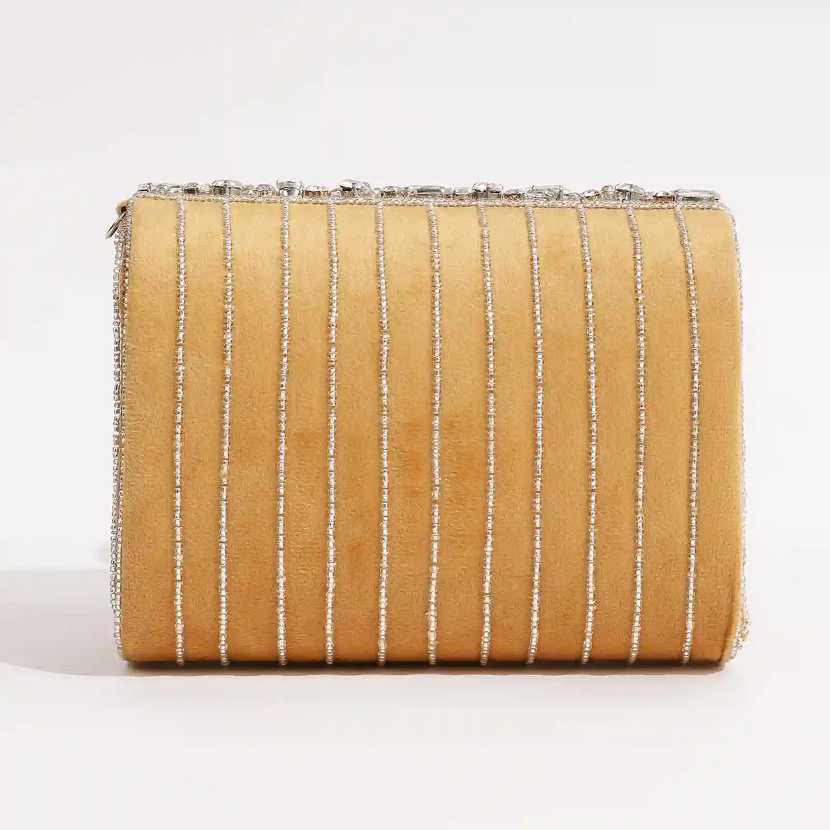 Grace embellished flap-over bag by The Tan Clan featuring a stylish design with decorative accents and a top handle.