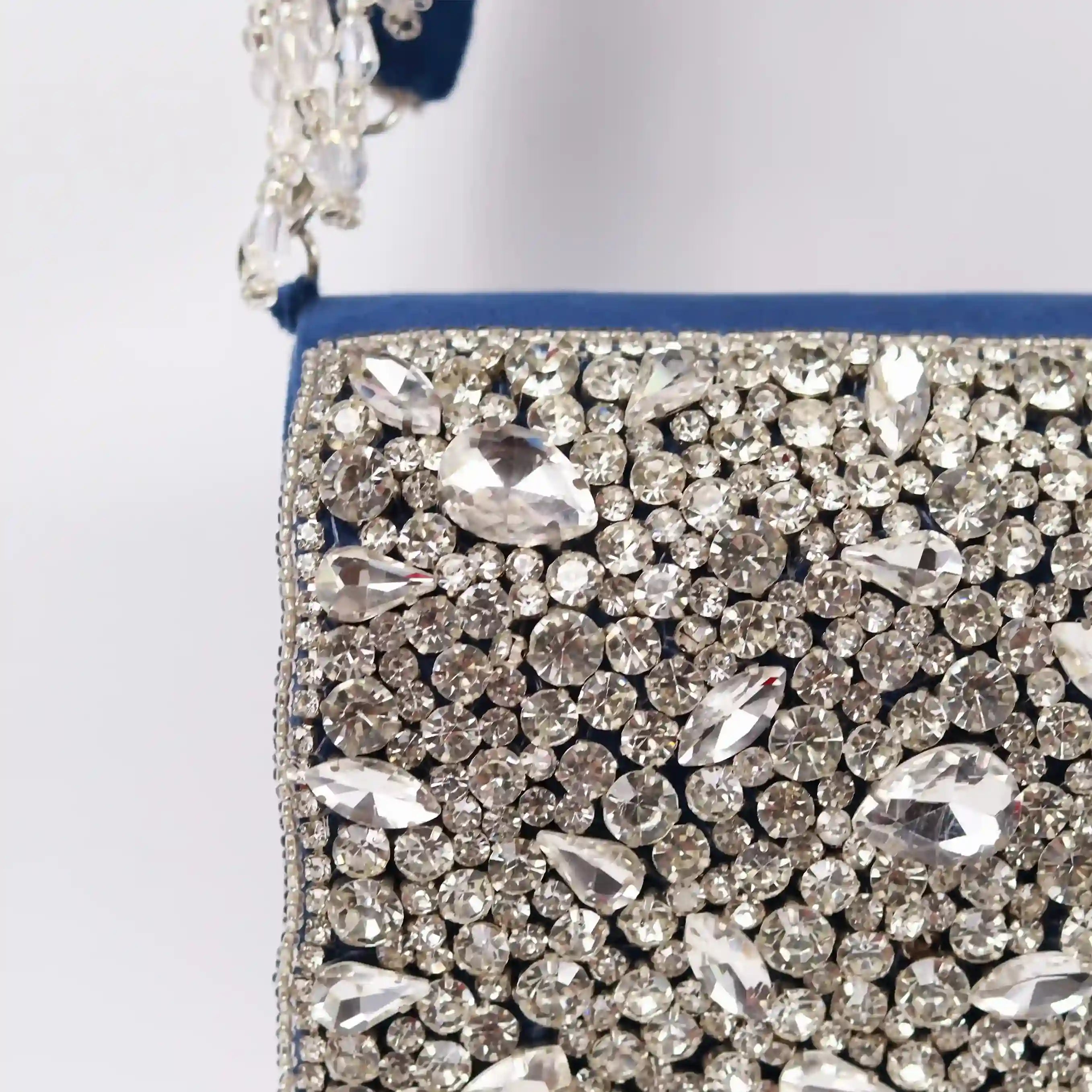 Grace Mini Bag by The Tan Clan featuring a blue fabric body and embroidered handle, stylish and compact for everyday use.