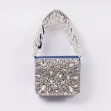 Grace Mini Bag by The Tan Clan with embroidered handle, featuring a compact design and stylish craftsmanship.