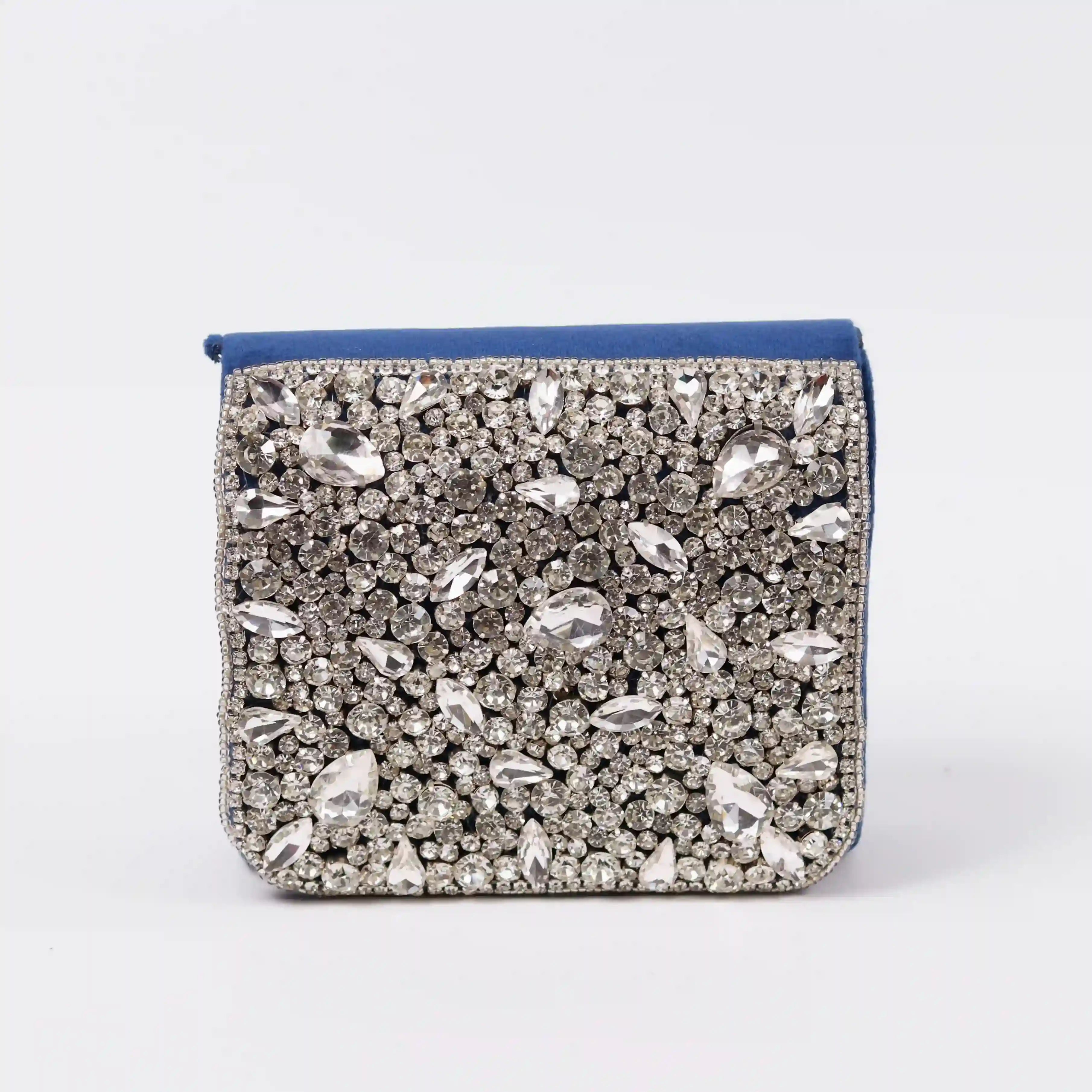 Blue Grace Mini Bag by The Tan Clan with a floral embroidered handle and compact design for stylish everyday use.