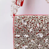 Grace Mini Bag by The Tan Clan with embroidered handle, featuring a compact design and stylish embellishments.