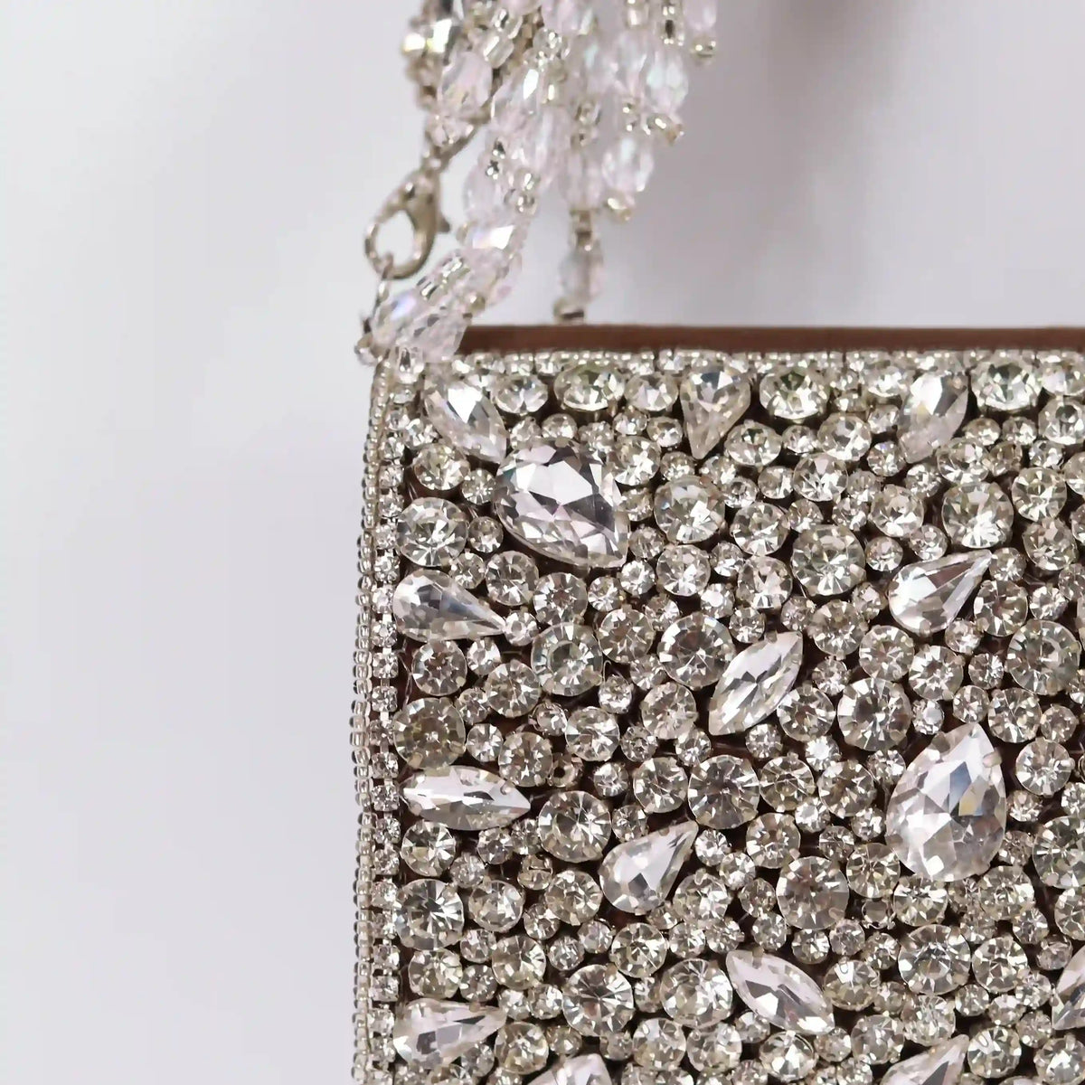 Grace Mini Bag with embroidered handle from The Tan Clan, stylish compact bag featuring detailed embroidery and a chic design.