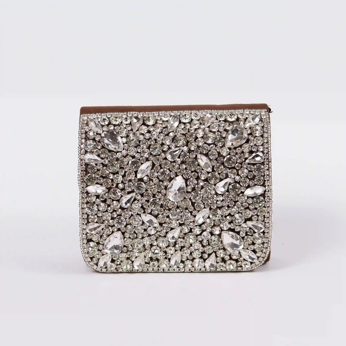 Grace mini bag by The Tan Clan featuring an embroidered handle and sleek design, perfect for stylish everyday use.