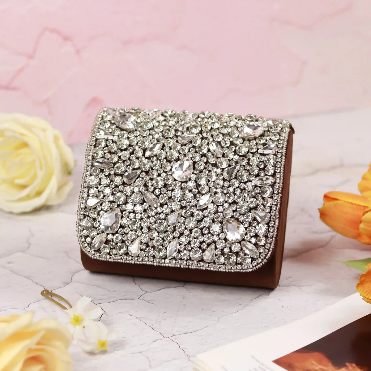 Grace Mini Bag by The Tan Clan with embroidered handle, featuring a compact design and stylish embroidery detail.