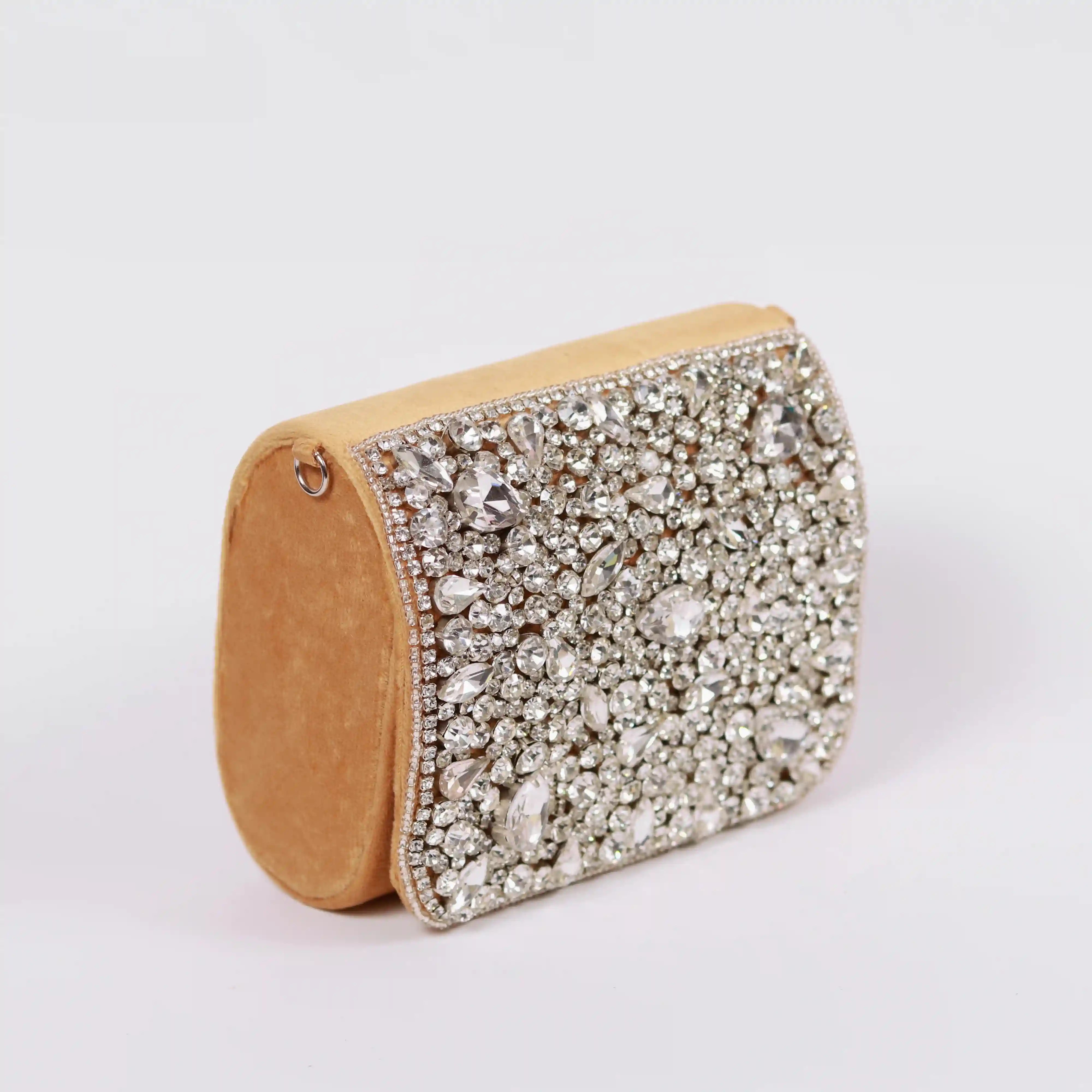 Gold mini bag with embroidered handle from The Tan Clan's Grace collection, featuring a stylish, compact design and intricate embroidery.