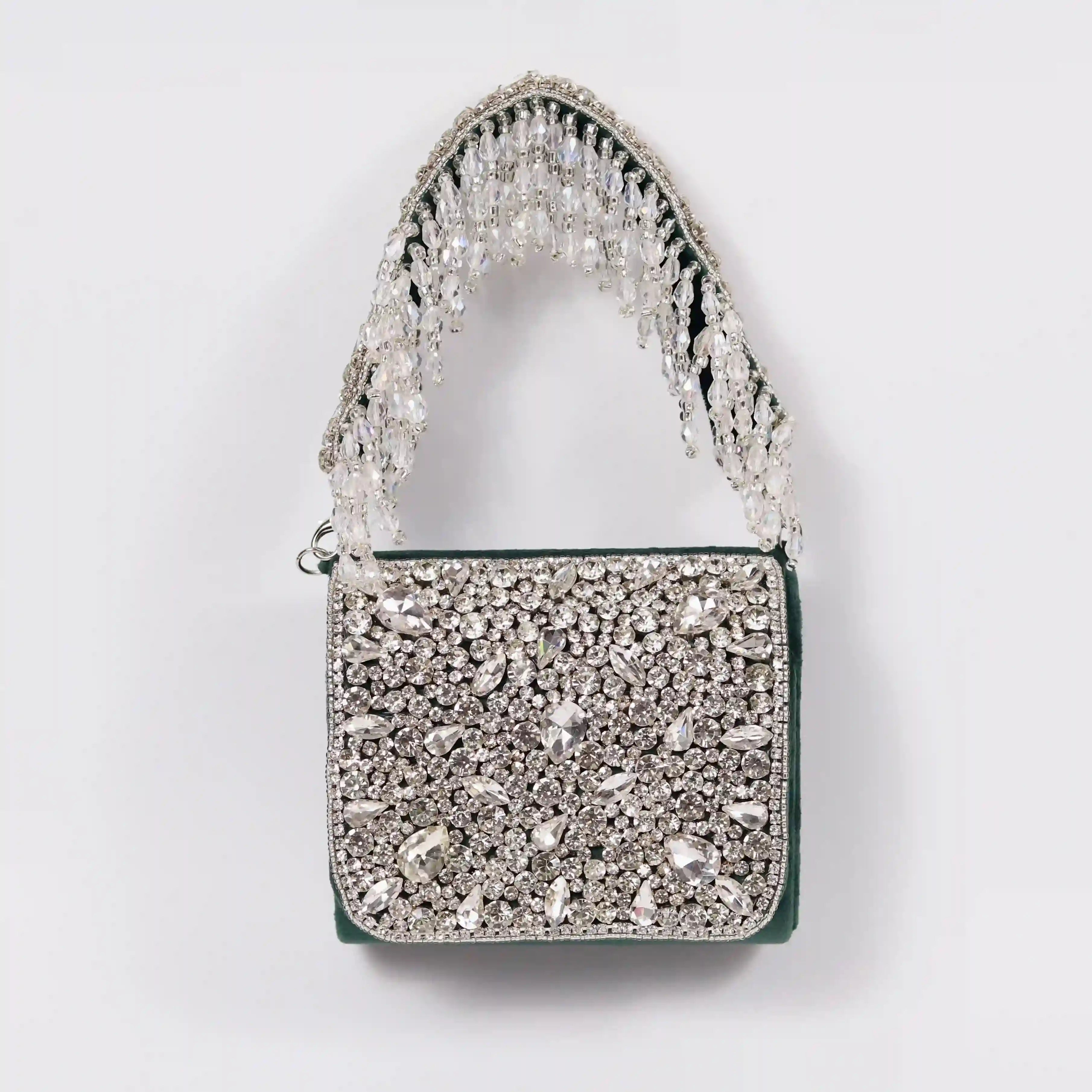 Green Grace Mini Bag by The Tan Clan featuring an embroidered handle and sleek design.