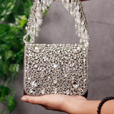 Grace mini bag from The Tan Clan featuring an embroidered handle and compact design, perfect for stylish everyday use.