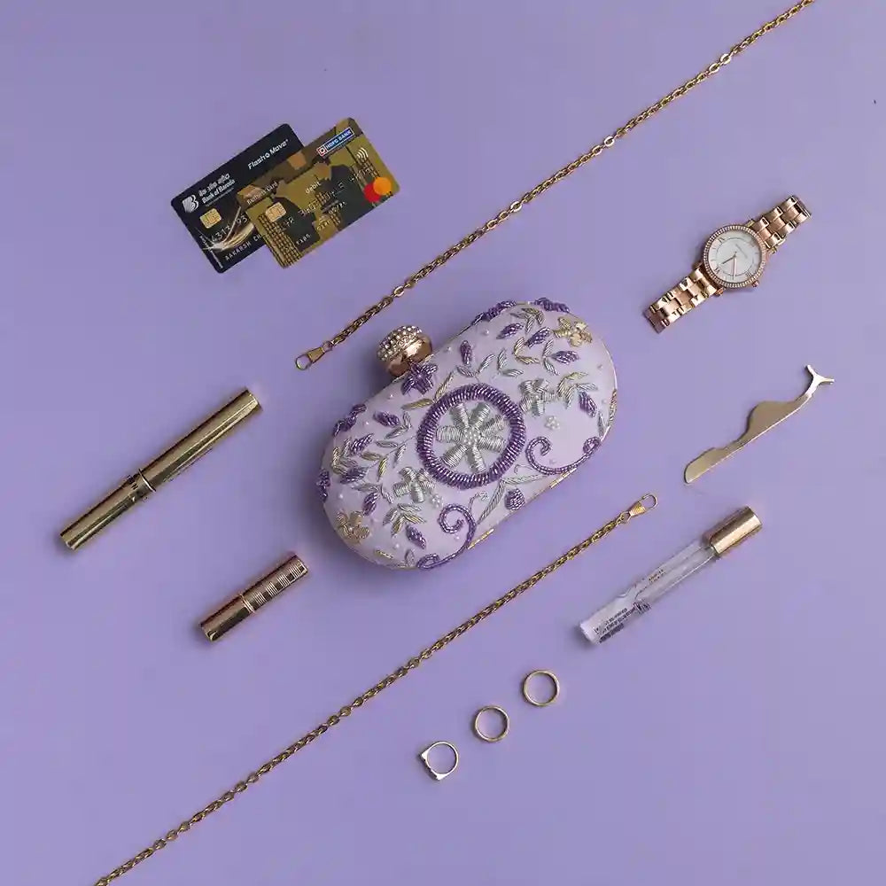 Gul Lilac hand-embroidered clutch by The Tan Clan featuring intricate floral embroidery and a sleek rectangular design.