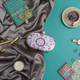 Gul Lilac hand-embroidered clutch purse by The Tan Clan, featuring intricate floral embroidery and a sleek, rectangular design.