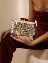 Hannah embellished mother of pearl clutch from The Tan Clan featuring intricate beadwork and a sleek, elegant design.