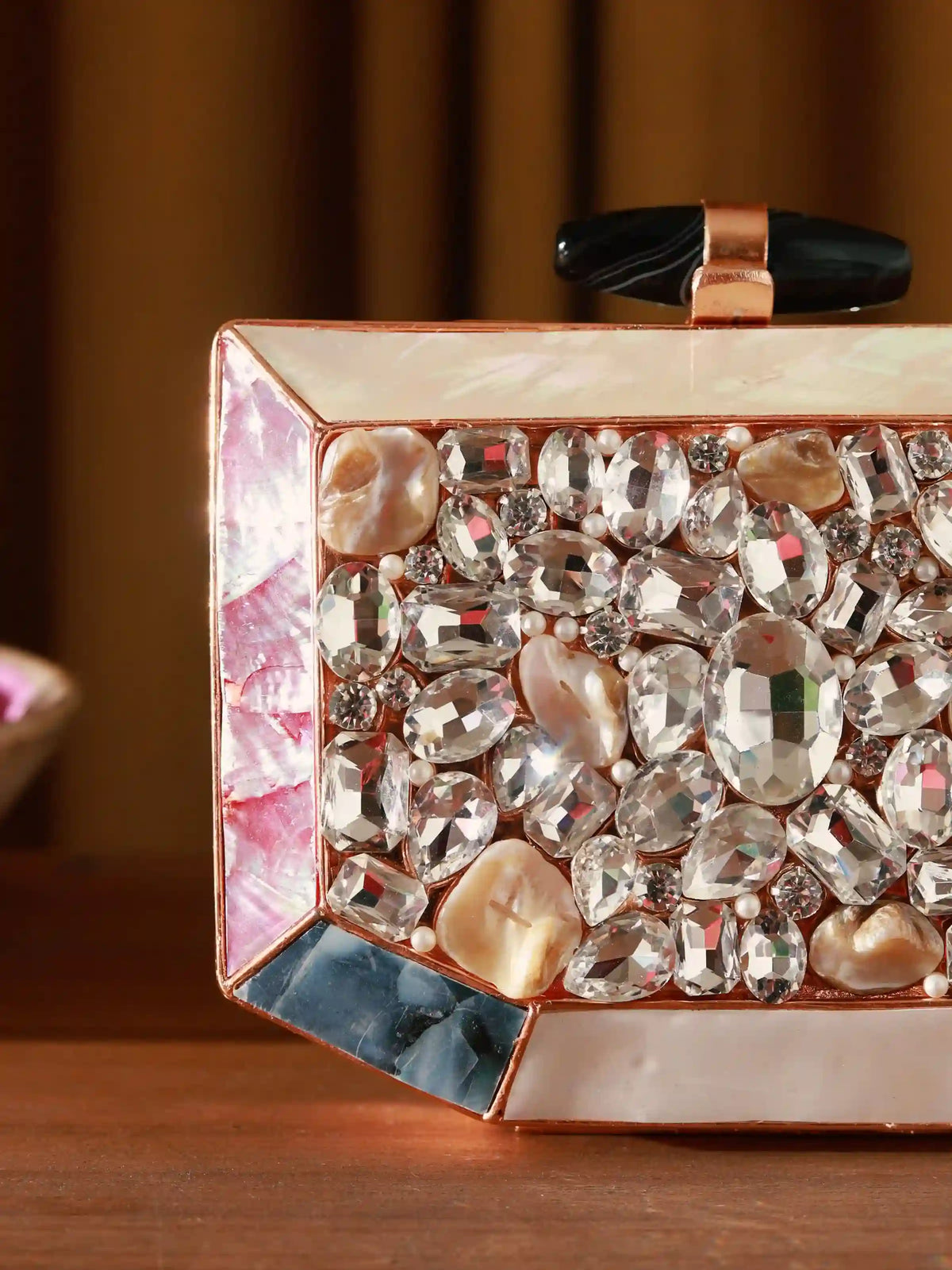 Hannah embellished mother of pearl clutch bag by The Tan Clan with intricate detailing and elegant design.