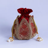 Hand-embroidered mini lotus potli bag from The Tan Clan with intricate embroidery and traditional design.