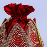 Hand-embroidered mini lotus potli bag by The Tan Clan with intricate floral embroidery and traditional drawstring closure.