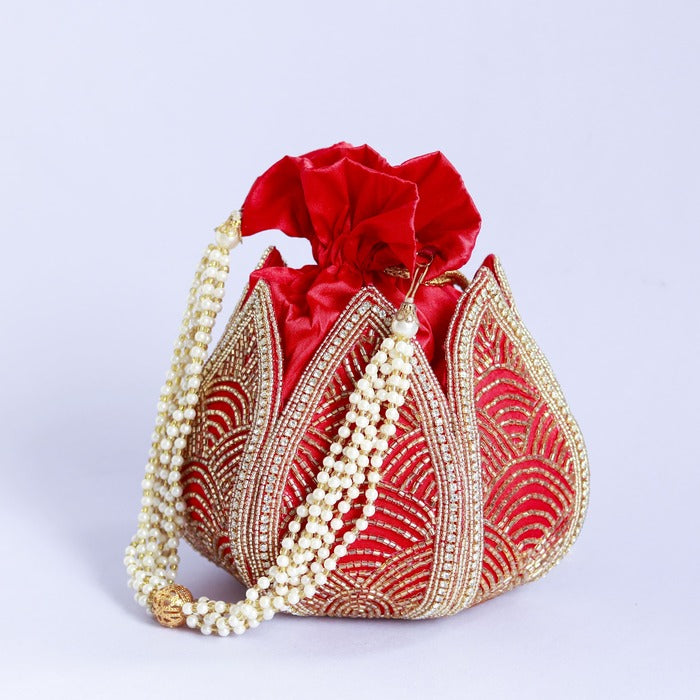 Hand-embroidered mini lotus potli bag by The Tan Clan, featuring intricate embroidery and traditional Indian design.