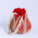 Hand-embroidered mini lotus potli bag by The Tan Clan, featuring intricate embroidery and traditional Indian design.