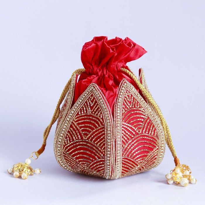 Hand-embroidered mini lotus potli bag with intricate detailing by The Tan Clan, featuring traditional embroidery and a drawstring closure.