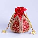 Hand-embroidered mini lotus potli bag with intricate detailing by The Tan Clan, featuring traditional embroidery and a drawstring closure.