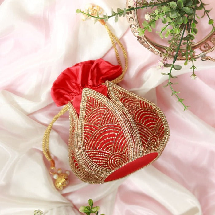 Hand-embroidered mini lotus potli bag by The Tan Clan with intricate embroidery and traditional design.