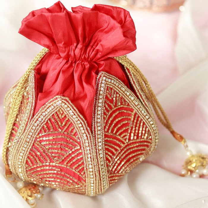 Hand embroidered mini Lotus Potli bag by The Tan Clan with intricate traditional design and vibrant colors.