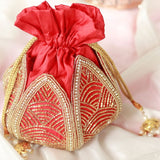 Hand embroidered mini Lotus Potli bag by The Tan Clan with intricate traditional design and vibrant colors.