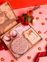 Her Pamper Hamper set featuring an Ariba clutch, a candle, and three Kimirica skincare products from THE TAN CLAN.
