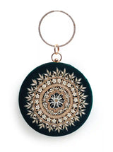 Green round clutch bag with intricate hand embroidery by The Tan Clan, featuring traditional design and detailed craftsmanship.