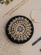 Ifrah round hand-embroidered clutch by The Tan Clan featuring intricate embroidery and a compact, stylish design.