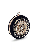 Round hand-embroidered clutch bag from The Tan Clan with intricate embroidery and a compact, stylish design.