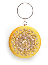 Yellow round embroidered clutch bag by The Tan Clan with intricate hand embroidery and a stylish, compact design.