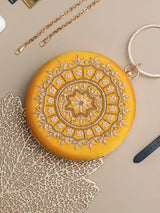 Yellow round embroidered clutch bag with intricate hand embroidery, designed by The Tan Clan for stylish accessories.