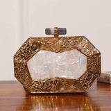 Inaayat brass clutch with mother of pearl details from The Tan Clan, showcasing intricate craftsmanship and elegant design.