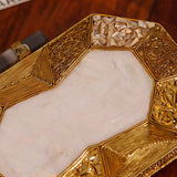 Inaayat Brass Mother of Pearl Clutch by The Tan Clan, showcasing intricate brass design with elegant mother of pearl accents.