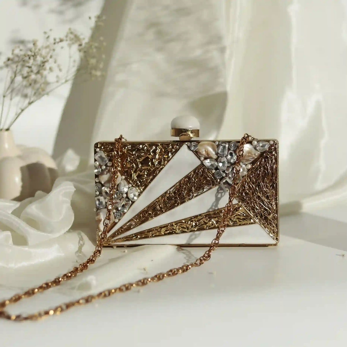 Elegant Iqra embellished mother of pearl clutch by The Tan Clan, showcasing intricate pearl and bead detailing on a sleek evening bag.
