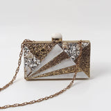 Elegant Iqra embroidered mother of pearl clutch by The Tan Clan with intricate embellishments and a sleek design.
