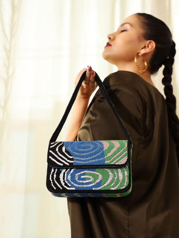 Iris Baguette Bag with Handle by The Tan Clan, stylish leather handbag featuring a sleek design and top handle for versatile carrying.